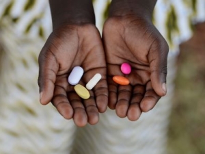 Hands holding meds